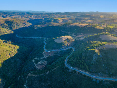 Aerial view of a mountain road crossing the Rio Macas in Braganza, Portugal.