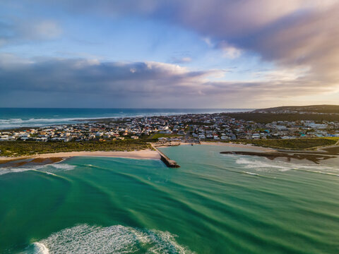 Aerial view of small fishing harbour Struisbaai and surrounding village about four kilometres from Cape Agulhas, the southernmost point of the African continent, Western Cape, South Africa.