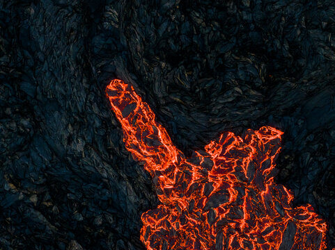 Aerial view of lava flowing from Litli-Hrutur (Little Ram) Volcano during an eruption on Fagradalsfjall volcanic area in southwest Iceland at night, it's a fissure eruption, Iceland