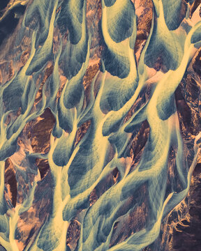 Aerial view of abstract water formation from river estuary along the coastline in Hvolsvollur, Southern Region, Iceland.