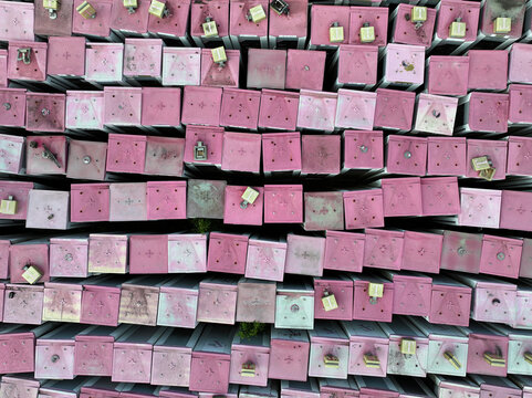 Aerial view of a phone box graveyard, a storage and dismantling facility for old phone boxes in Brandenburg, Germany.