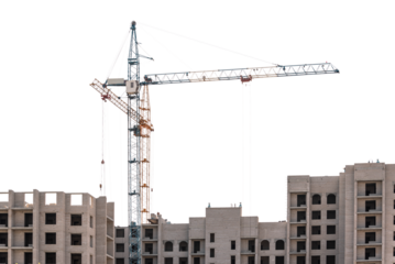 Construction of multi-storey buildings with tower cranes on a white isolated background.