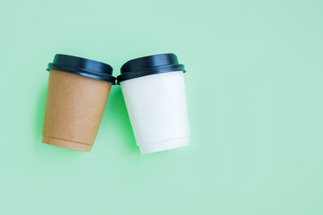White and Brown paper coffee cup on green background, Takeaway coffee cup