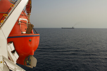 Propeller and rudder of a life boat secured onboard a merchant ship at sea © Antony
