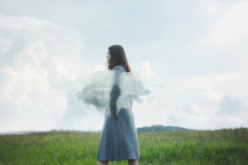 surreal woman walking under her arm a cloud in a field, abstract