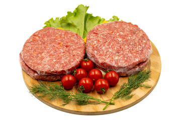Raw hamburger patty isolated on white background. Raw veal hamburger patties with herbs and spices. Close up