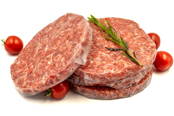 Raw hamburger patty isolated on white background. Raw veal hamburger patties with herbs and spices