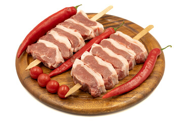 Raw lamb tenderloin isolated on white background. Raw lamb tenderloin with herbs and spices