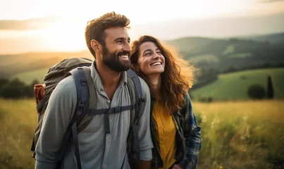 Fotobehang Couple hiker traveling, walking Italian Tuscan Landscape view under sunset light. Man and Woman traveler enjoys with backpack hiking in mountains. Travel, adventure, relax, recharge concept. © Andrii IURLOV