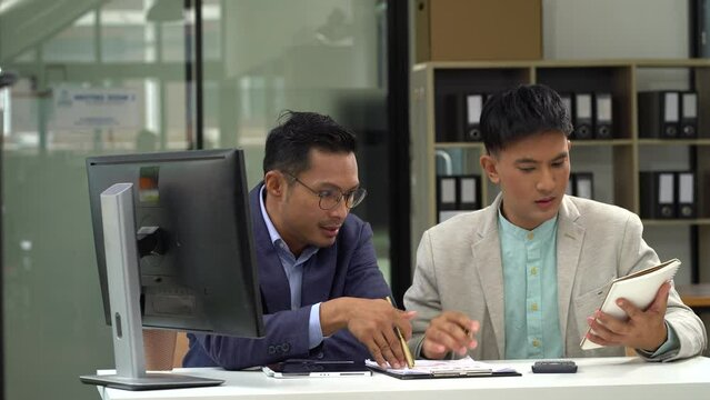 Failed teamwork concept.  teamwork, people and crisis concept - business team sitting sad and solving problems in the office.