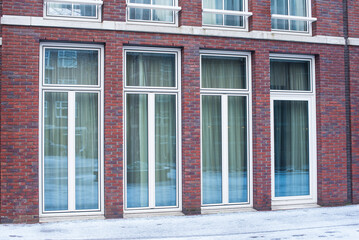 modern red brick building with big windows
