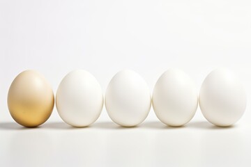 Golden egg among white eggs.