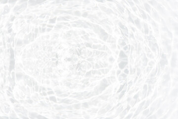 Fototapeta premium White water with ripples on the surface. Defocus blurred transparent white colored clear calm water surface texture with splashes and bubbles. Water waves with shining pattern texture background.