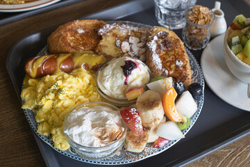 breakfast with scrambled eggs, toasts.