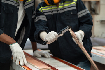 Hand technician craft man use vernier caliper to timber at wood factory	