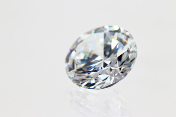 Closeup round cut cubic zirconia (CZ) diamond simulant on white background (photo) 
