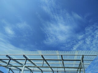 Clouds in blue sky with transparent plastic roof. Beautiful nature .background.