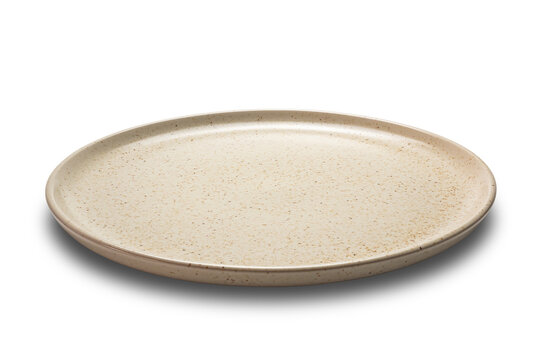 Side view closeup of brown ceramic plate isolated on white background.