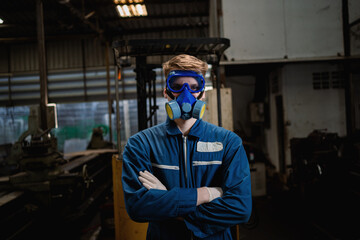 Industrial worker technologist wearing hazmat suit in manufacturing plant. Management of hazardous chemicals in factories.