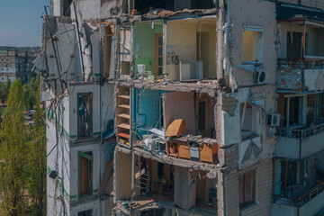 Fototapeta na wymiar A Russian rocket flew into a residential building in the city of Dnipro, Ukraine. A residential building destroyed by an explosion after a Russian missile attack from above. Scars of war.