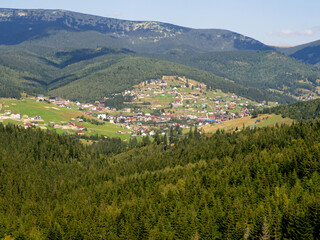 Summer view of mountain ski resort with houses and hotels in Bukovel, Ukraine