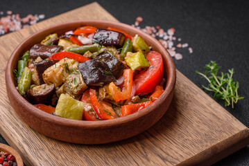Delicious fresh salad of grilled vegetables peppers, tomatoes, eggplants and zucchini