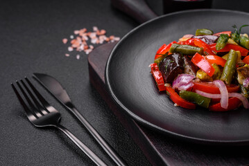 Delicious fresh salad of grilled vegetables peppers, tomatoes, eggplants and zucchini