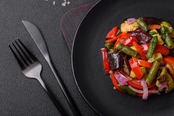 Delicious fresh salad of grilled vegetables peppers, tomatoes, eggplants and zucchini