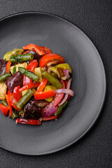 Delicious fresh salad of grilled vegetables peppers, tomatoes, eggplants and zucchini