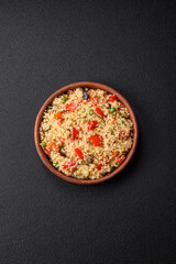 Delicious couscous porridge with cubes of grilled vegetables with salt and spices