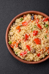 Delicious couscous porridge with cubes of grilled vegetables with salt and spices