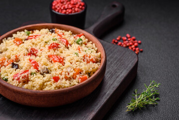 Delicious couscous porridge with cubes of grilled vegetables with salt and spices