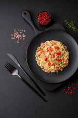 Delicious couscous porridge with cubes of grilled vegetables with salt and spices