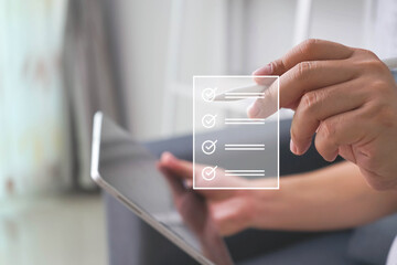 Business performance checklist, Quick checklist and clipboard management concept, job applicants, businessman using laptop doing online checklist survey,Employees must complete the online survey form.