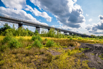 Fototapeta na wymiar A panorama view along the side of the Bennerley Viaduct over the Erewash canal in summertime