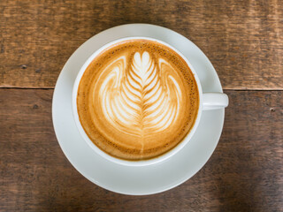 top view latte art rosetta in a white cup