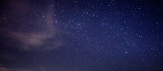 Obraz na płótnie Canvas Purple night sky full of stars as background
