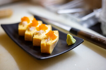 Egg sushi menu prepared by a Japanese chef in the restaurant