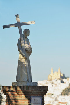Statue Of A Priest Holding A Cross; Olvera, Cadiz,Andalusia, Spain