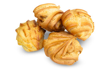 Pile of eclairs (profiteroles) close-up, side view isolated on a transparent background.