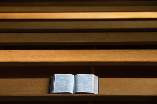 A bible open on a wooden bench; Northumberland england