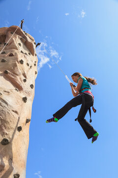 Girl on climbing wall edmonds waterfront festival; Edmonds washington united states of america
