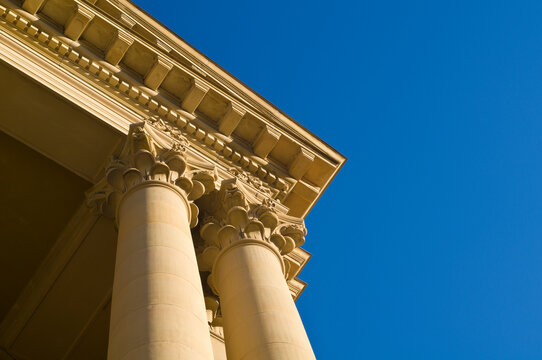 Stone architectural detail on the corner of a building against a blue sky; Edmonton alberta canada