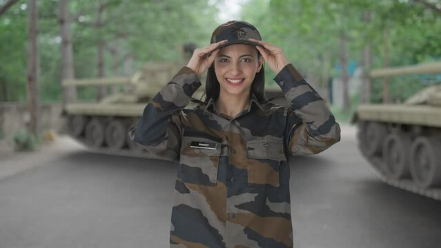 Happy Indian woman army officer getting ready for duty