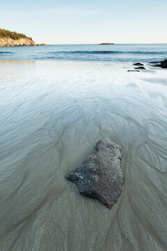 Sandy beach with water trails acadia national park; Maine united states of america