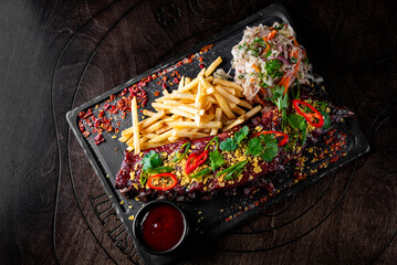 Pork ribs with french fries and coleslaw salad 