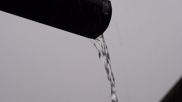 water flows from the gutter in slow motion