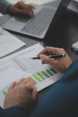 Financial Business team present. Business man hands hold documents with financial statistic stock photo, discussion, and analysis report data the charts and graphs. Finance Financial concept