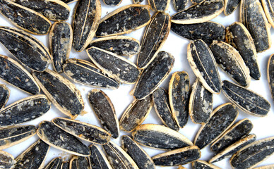 salty sunflower seeds isolated on white - 647751293