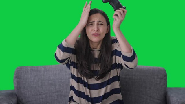 Sad Indian girl losses a video game Green screen